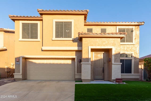 6321 S Teresa Dr, Chandler, AZ 85249 - view of front of house featuring an attached garage, concrete driveway, stucco siding, a tile roof, and a front yard