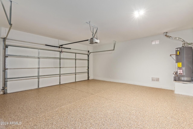 6321 S Teresa Dr, Chandler, AZ 85249 - garage with water heater, a garage door opener, and baseboards