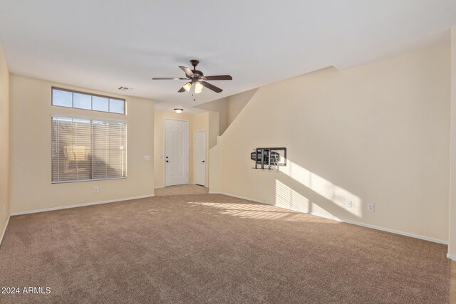 6321 S Teresa Dr, Chandler, AZ 85249 - unfurnished living room featuring a ceiling fan, carpet floors, and baseboards