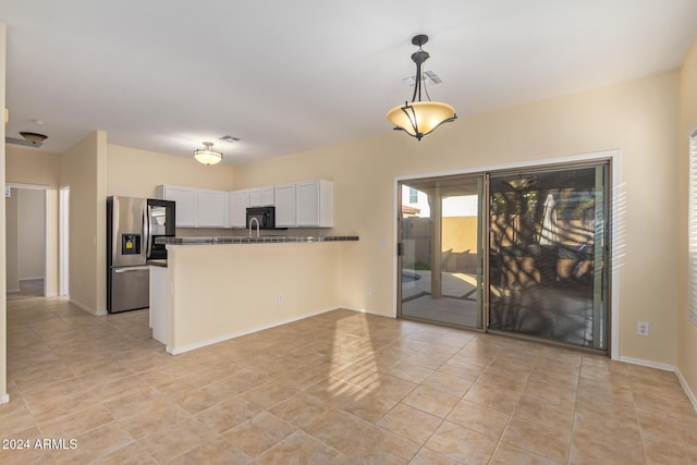 6321 S Teresa Dr, Chandler, AZ 85249 - kitchen featuring stainless steel refrigerator with ice dispenser, a peninsula, white cabinets, black microwave, and decorative light fixtures