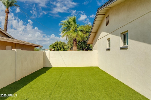 view of yard featuring a fenced backyard