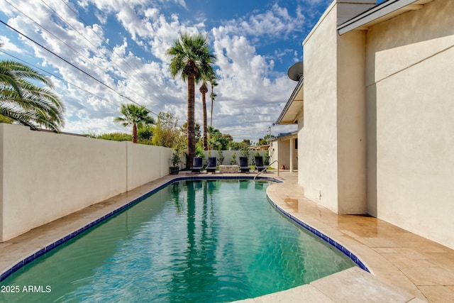 view of pool with a patio area, a fenced backyard, and a fenced in pool