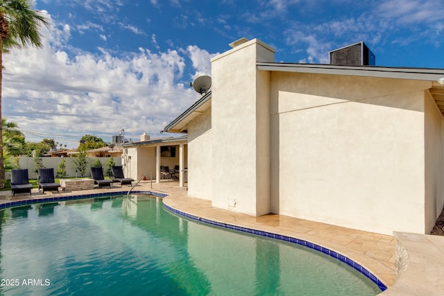 view of pool featuring a fenced in pool, a patio, and fence