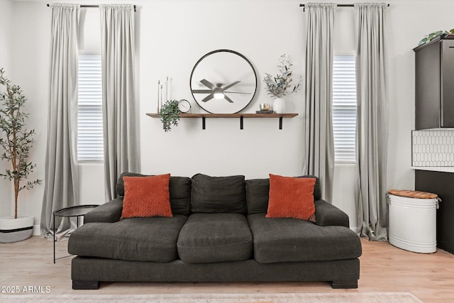 141 S 156th Dr, Goodyear, AZ 85338 - living room featuring a wealth of natural light and light wood-style floors