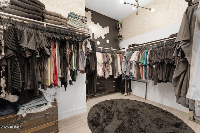 141 S 156th Dr, Goodyear, AZ 85338 - walk in closet featuring a notable chandelier and wood finished floors
