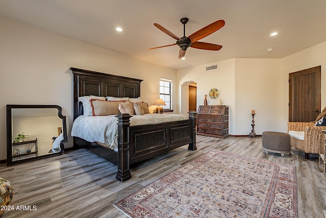 bedroom featuring ceiling fan and light hardwood / wood-style floors