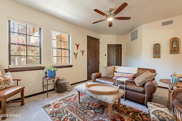 living room featuring carpet flooring and ceiling fan