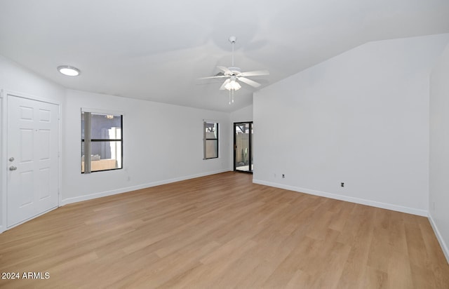 unfurnished room featuring ceiling fan, light wood-type flooring, and lofted ceiling