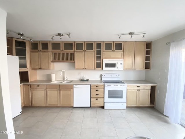 kitchen featuring light brown cabinets, white appliances, a sink, light countertops, and open shelves