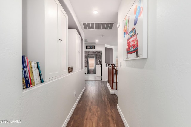 corridor featuring dark hardwood / wood-style flooring