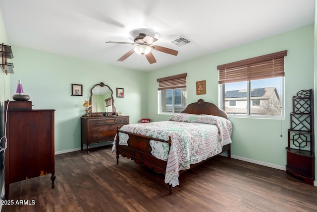 bedroom featuring ceiling fan and dark wood-type flooring