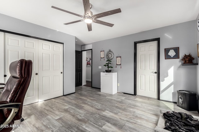 office area with ceiling fan and light hardwood / wood-style floors