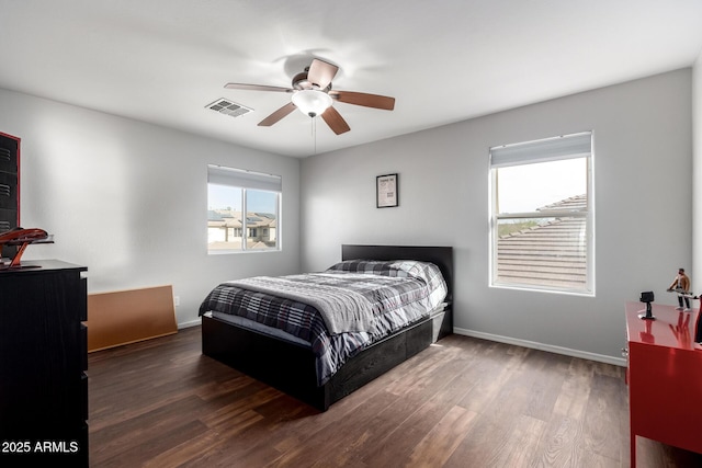 bedroom featuring ceiling fan and dark hardwood / wood-style floors