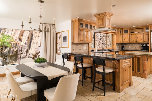 4636 E Moonlight Way, Paradise Valley, AZ 85253 - kitchen featuring stone tile flooring, decorative backsplash, recessed lighting, and glass insert cabinets