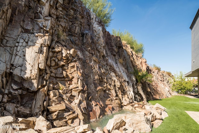 4636 E Moonlight Way, Paradise Valley, AZ 85253 - view of property exterior with a yard and stone siding