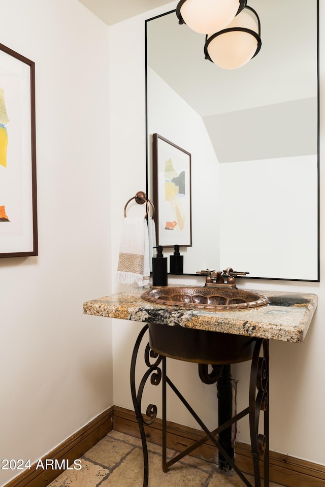 4636 E Moonlight Way, Paradise Valley, AZ 85253 - bathroom featuring baseboards and vaulted ceiling