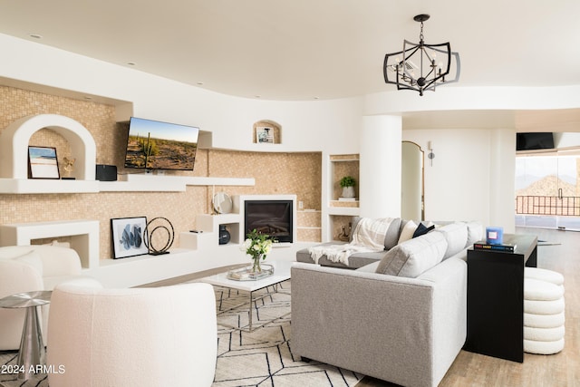 4636 E Moonlight Way, Paradise Valley, AZ 85253 - living area featuring a chandelier and light wood finished floors