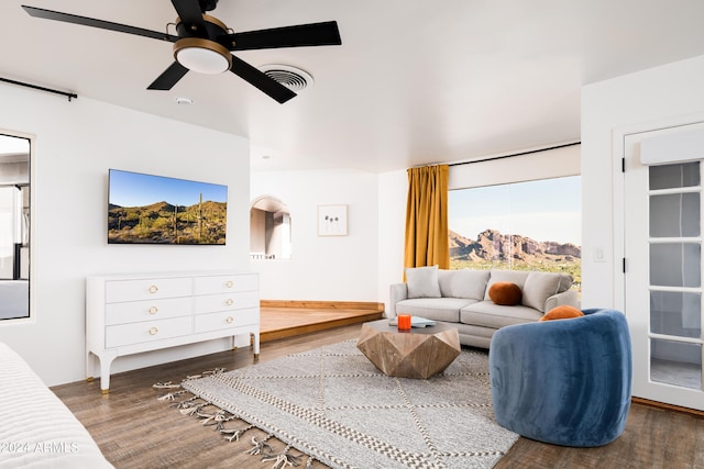 4636 E Moonlight Way, Paradise Valley, AZ 85253 - living room featuring wood finished floors, ceiling fan, and arched walkways