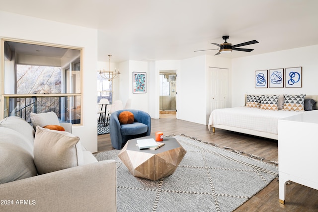 4636 E Moonlight Way, Paradise Valley, AZ 85253 - living room with wood finished floors, a chandelier, and a ceiling fan