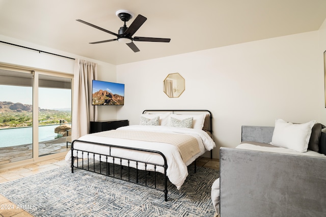 bedroom with access to exterior and ceiling fan