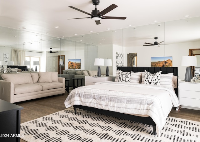 bedroom with hardwood / wood-style floors and ceiling fan