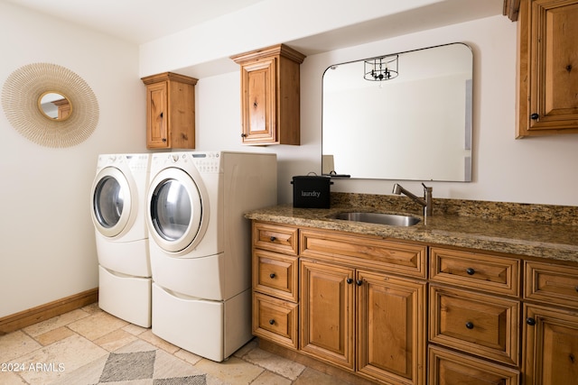 4636 E Moonlight Way, Paradise Valley, AZ 85253 - washroom with washing machine and dryer, cabinet space, stone tile floors, and baseboards