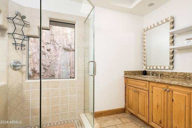 4636 E Moonlight Way, Paradise Valley, AZ 85253 - full bath featuring a stall shower, stone tile flooring, vanity, and baseboards