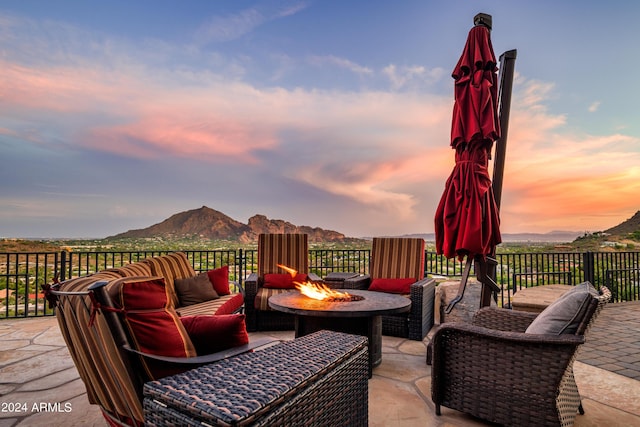 4636 E Moonlight Way, Paradise Valley, AZ 85253 - wooden terrace with a mountain view, a patio, and an outdoor living space with a fire pit