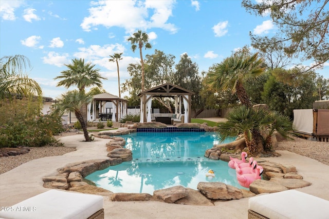 view of swimming pool with a fenced in pool, fence, and a gazebo