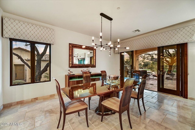 2744 S First Water Ln, Gold Canyon, AZ 85118 - dining room featuring visible vents, baseboards, an inviting chandelier, french doors, and stone tile floors