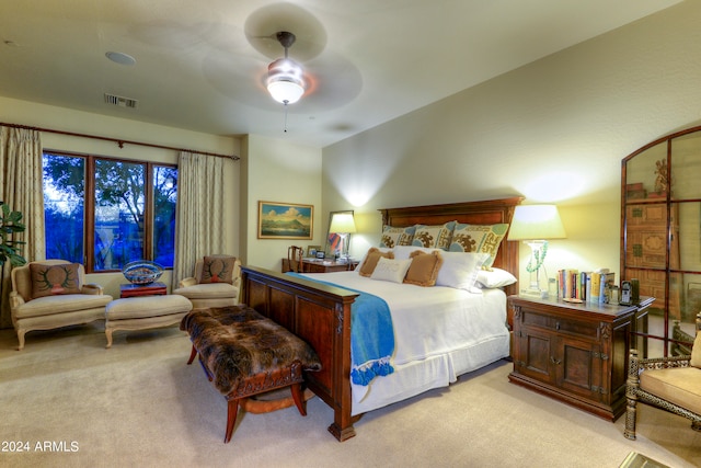 bedroom with ceiling fan and light colored carpet