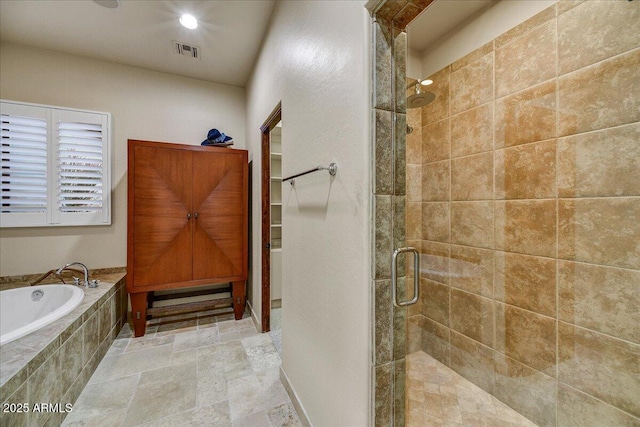 2744 S First Water Ln, Gold Canyon, AZ 85118 - bathroom with a garden tub, a shower stall, a walk in closet, stone tile flooring, and visible vents
