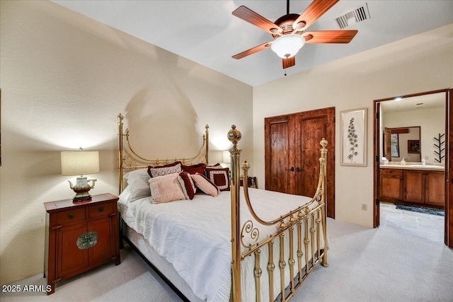 2744 S First Water Ln, Gold Canyon, AZ 85118 - bedroom featuring visible vents, ceiling fan, light carpet, a sink, and ensuite bath