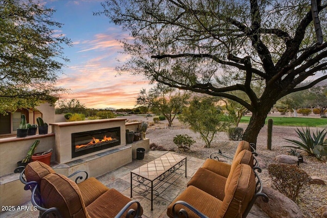 2744 S First Water Ln, Gold Canyon, AZ 85118 - view of patio with an outdoor living space with a fireplace