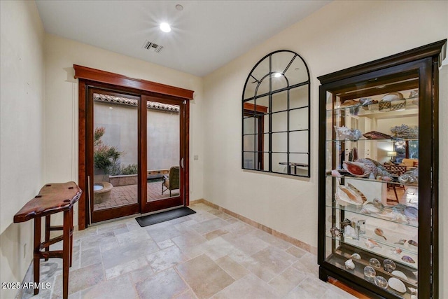 2744 S First Water Ln, Gold Canyon, AZ 85118 - entrance foyer featuring french doors, stone tile flooring, baseboards, and visible vents