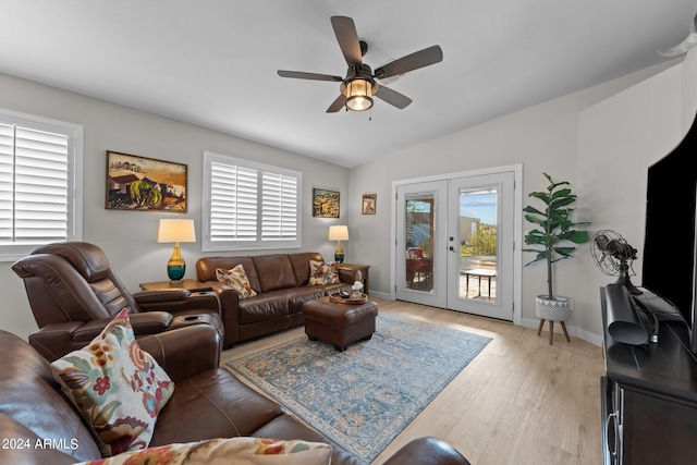 living room featuring french doors, light hardwood / wood-style flooring, ceiling fan, and lofted ceiling