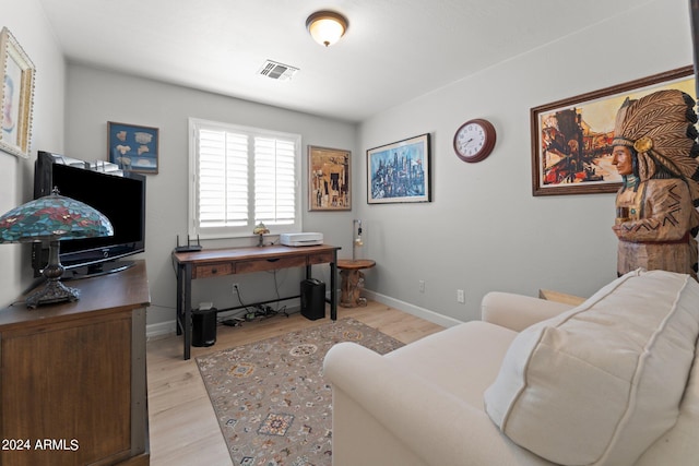 office space with light hardwood / wood-style floors