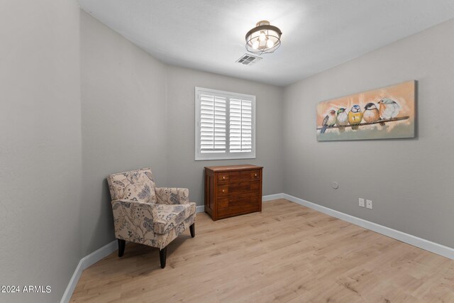 bathroom with hardwood / wood-style flooring, vanity, and toilet