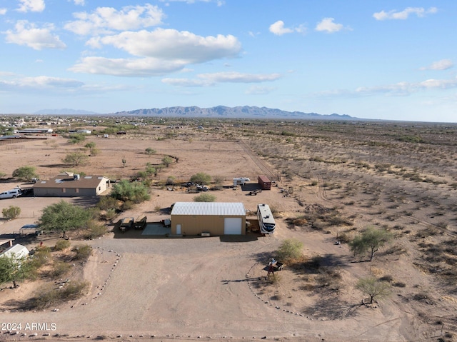 birds eye view of property featuring a mountain view