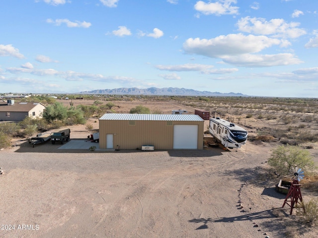 birds eye view of property with a mountain view