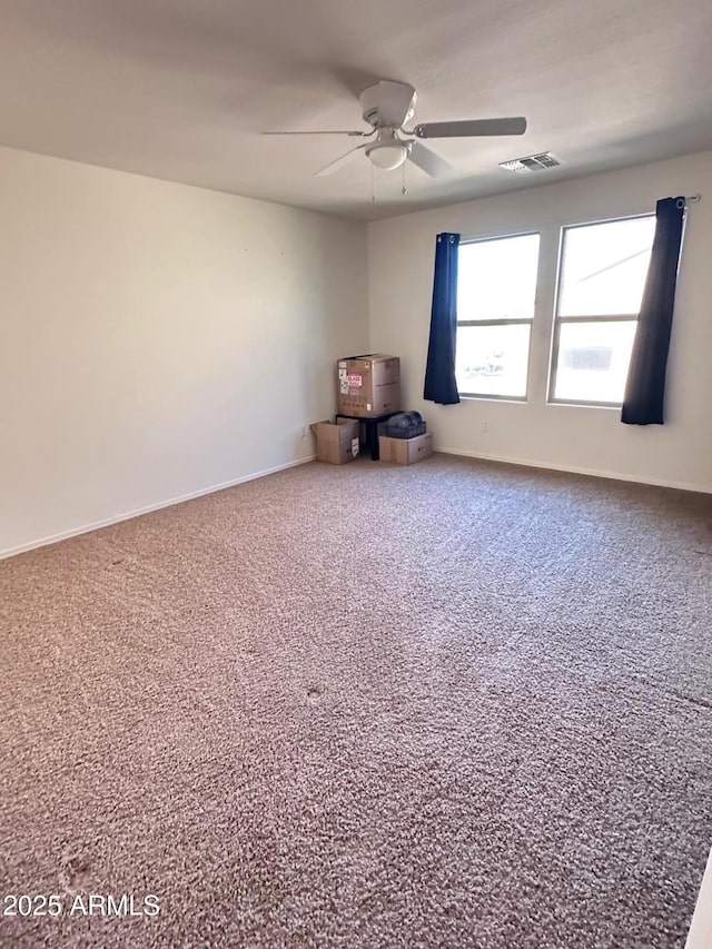 empty room with carpet and ceiling fan