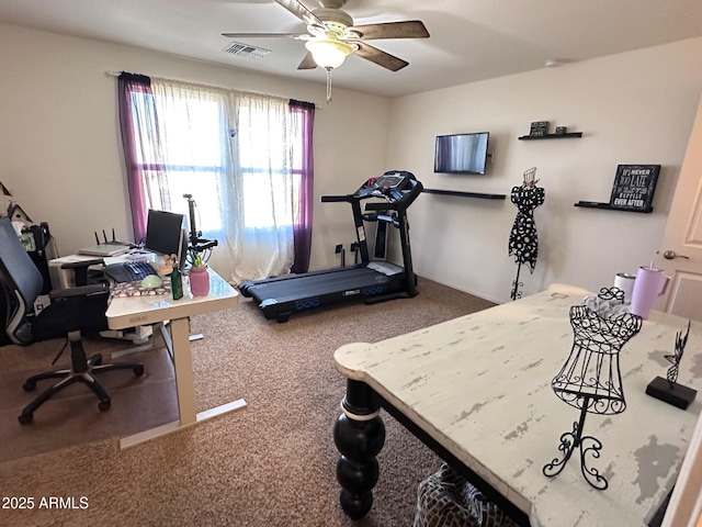 workout room with ceiling fan and carpet floors