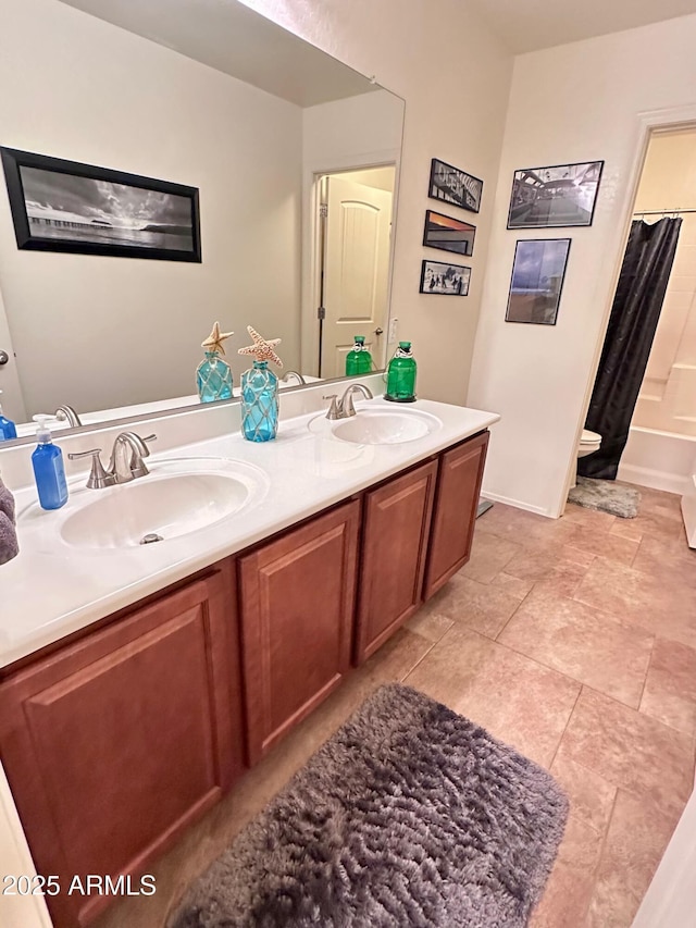 bathroom featuring shower / bath combo with shower curtain and vanity