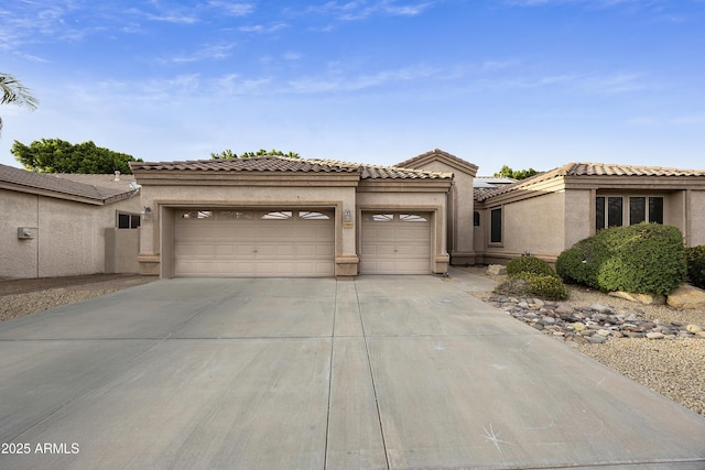 7262 W Firebird Dr, Glendale, AZ 85308 - view of front of property with a garage, concrete driveway, and stucco siding