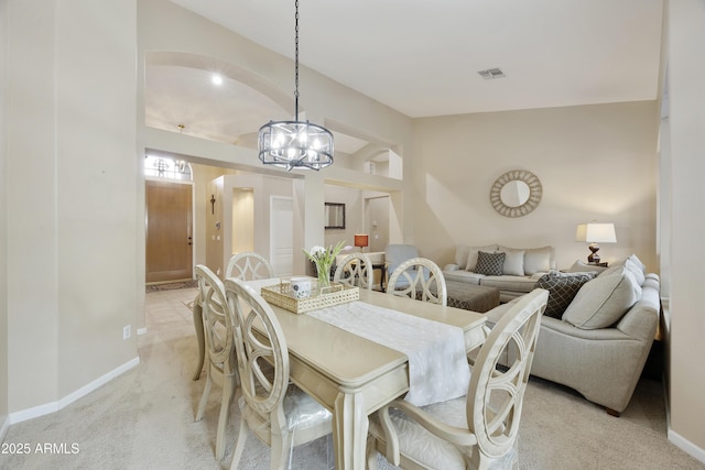 7262 W Firebird Dr, Glendale, AZ 85308 - dining space featuring light carpet, baseboards, and a chandelier