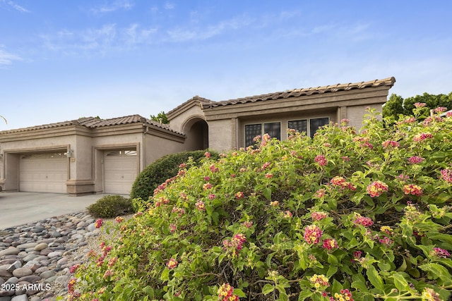 7262 W Firebird Dr, Glendale, AZ 85308 - view of front facade with an attached garage, stucco siding, driveway, and a tile roof