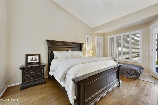 7262 W Firebird Dr, Glendale, AZ 85308 - bedroom featuring vaulted ceiling, wood finished floors, and baseboards