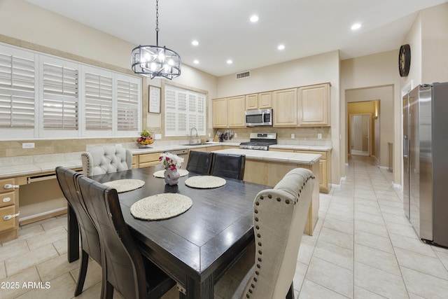 7262 W Firebird Dr, Glendale, AZ 85308 - dining room featuring light tile patterned floors, recessed lighting, a chandelier, and baseboards