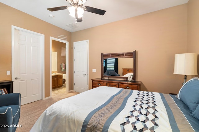 carpeted bedroom featuring ceiling fan and connected bathroom