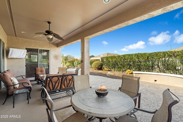 view of patio featuring ceiling fan